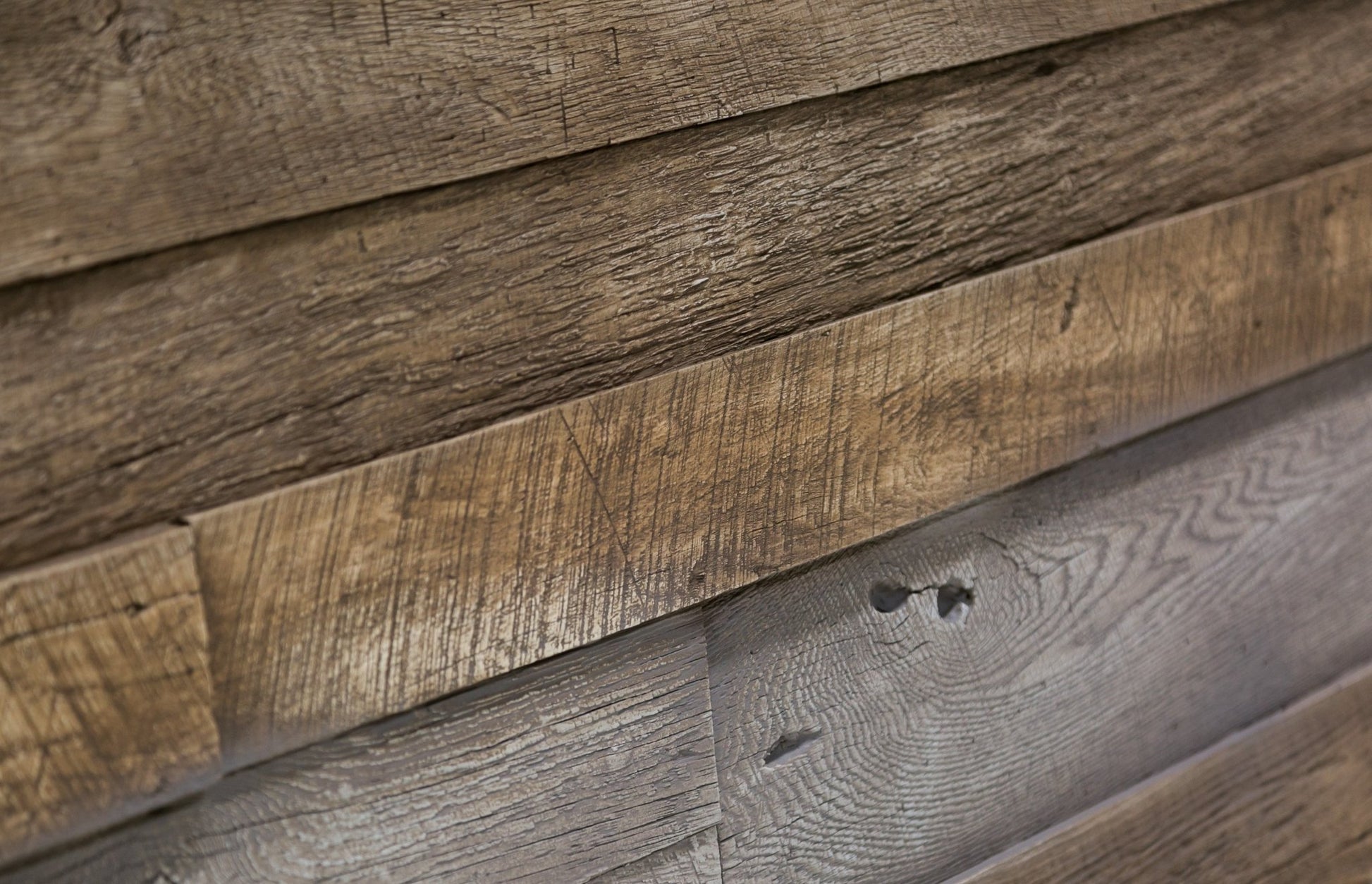 Reclaimed faux wood wall panel detail varied boards with saw marks and knot holes; realistic grain and layered plank relief.